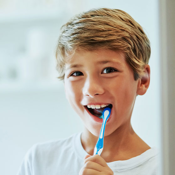 Boy brushing his teeth
