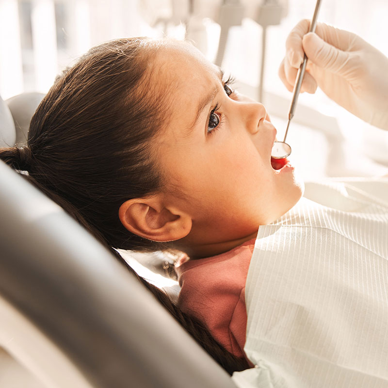 Girl at pediatric dentist