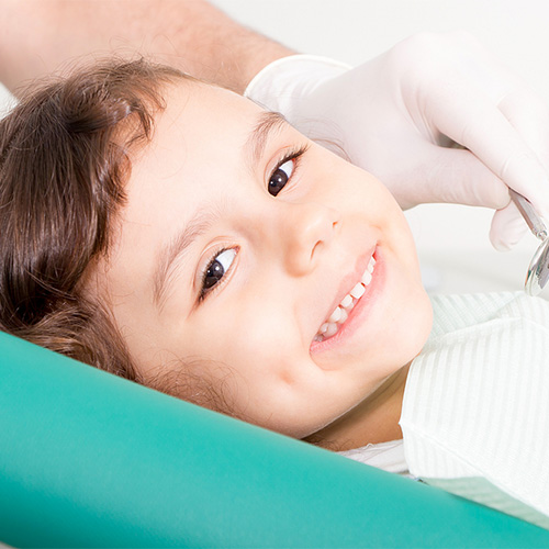 Boy smiling during dental exam